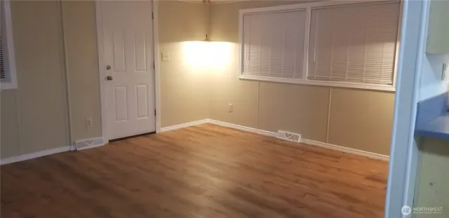 a kitchen with sink and cabinets