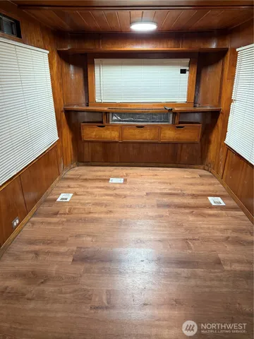 a kitchen with stainless steel appliances granite countertop a sink and a refrigerator