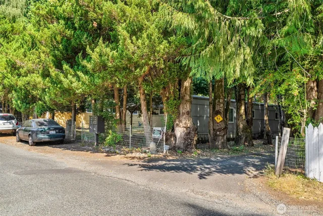 a view of street with parked cars