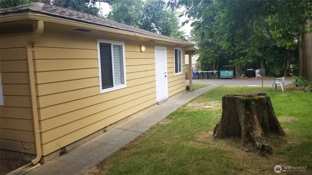 a view of a backyard with sitting area