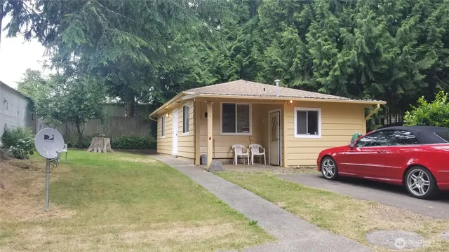 a front view of a house with garden