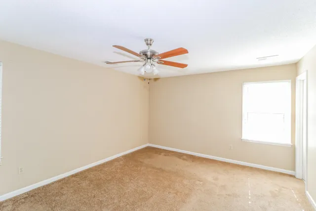 an empty room with a empty space and window