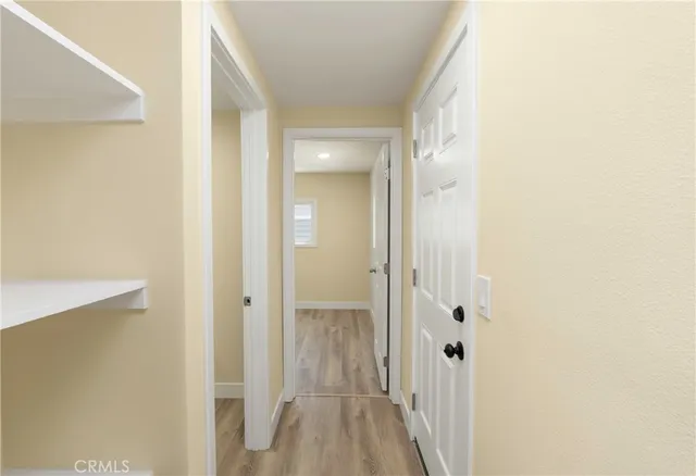 a view of a bathroom from a hallway