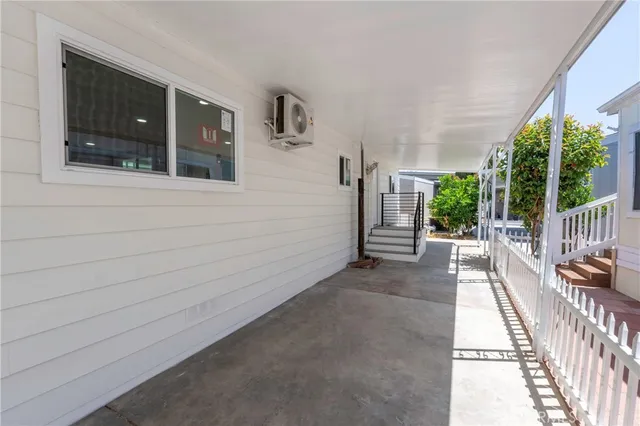 a view of a house with backyard and porch