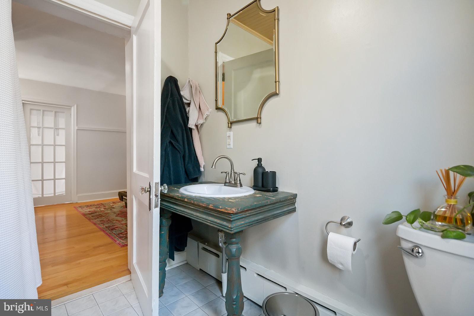 516 Kauffman Street Philadelphia, PA 19147 - Photo 20 of 37 a view of bathroom with a sink and mirror