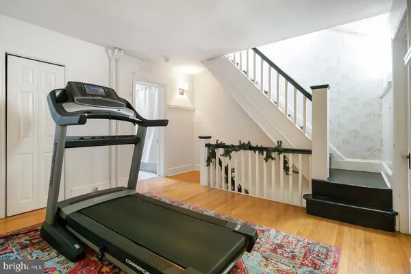 a living room with a bed furniture and a window