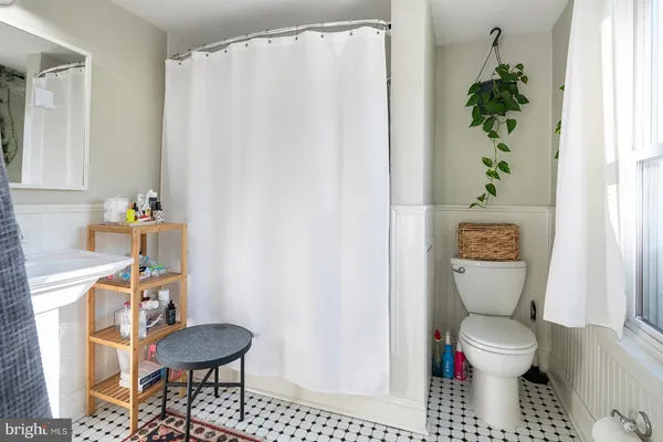 a bathroom with a toilet and a sink