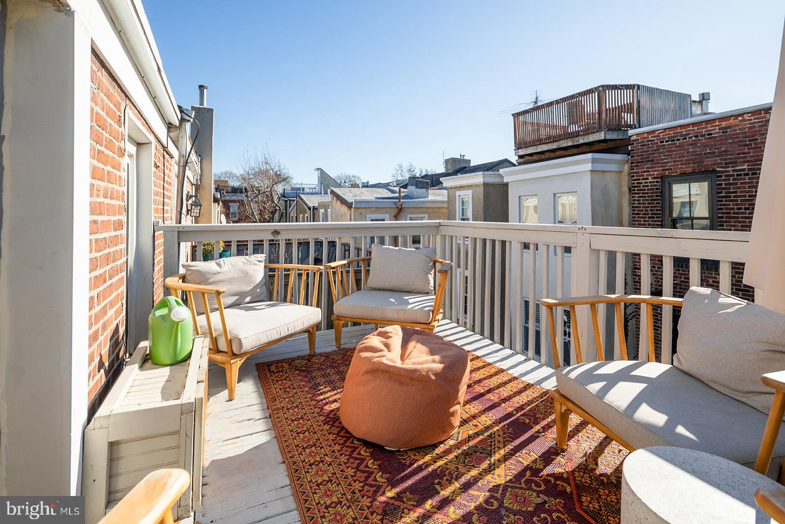 516 Kauffman Street Philadelphia, PA 19147 - Photo 33 of 37 a balcony with wooden floor and furniture