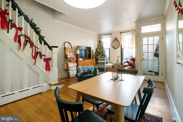 a view of a dining room with furniture and window