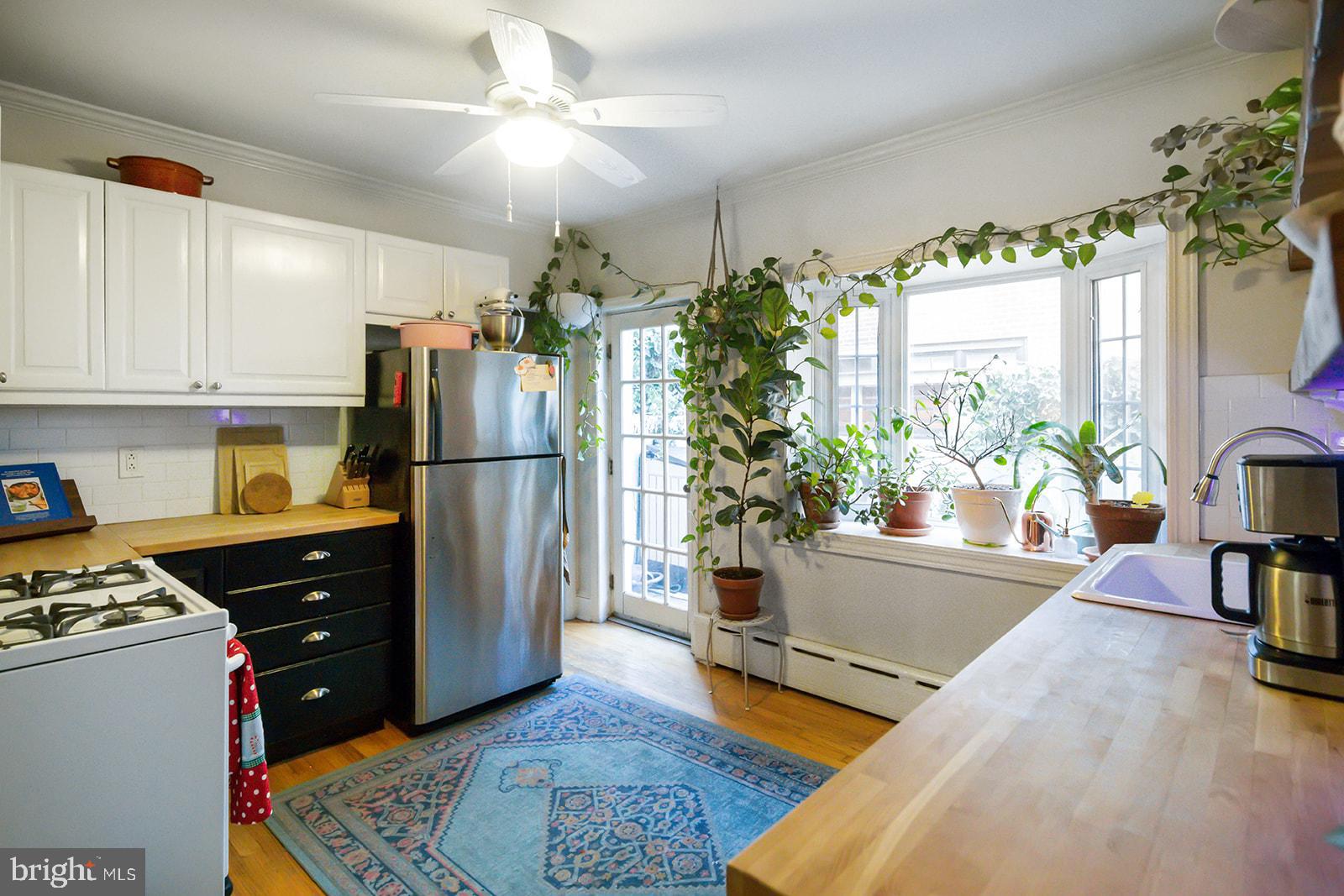 516 Kauffman Street Philadelphia, PA 19147 - Photo 9 of 37 a kitchen with a refrigerator and a stove