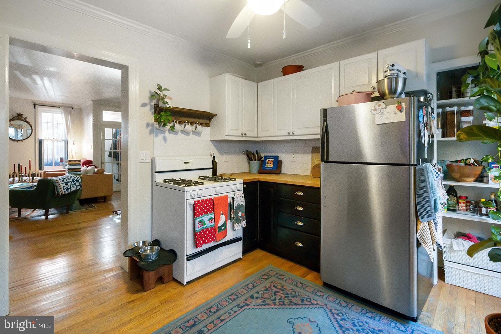 516 Kauffman Street Philadelphia, PA 19147 - Photo 10 of 37 a kitchen with refrigerator and wooden floor