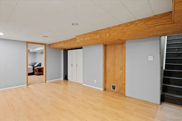 a view of a livingroom with wooden floor and closet