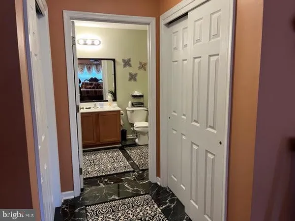 a room with a table and a fireplace