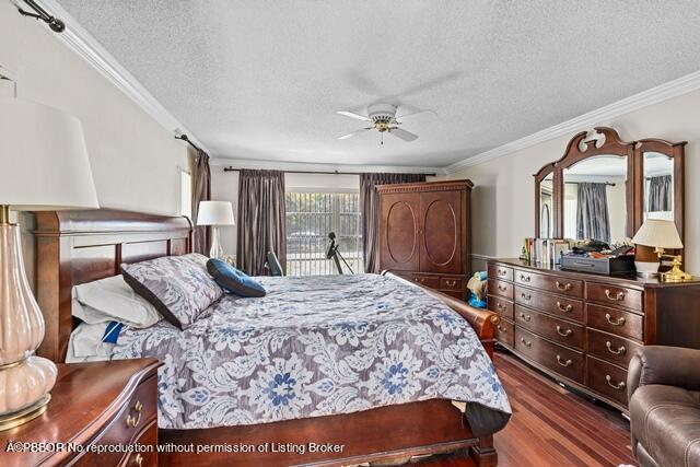 14 Bamboo Lane Jupiter, FL 33458 - Photo 13 of 33 a bedroom with a bed a dresser and mirror