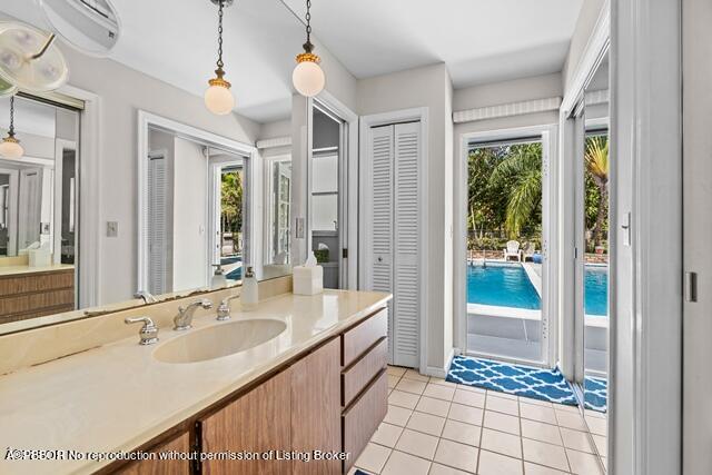 14 Bamboo Lane Jupiter, FL 33458 - Photo 14 of 33 a spacious bathroom with a double vanity sink a mirror and a shower