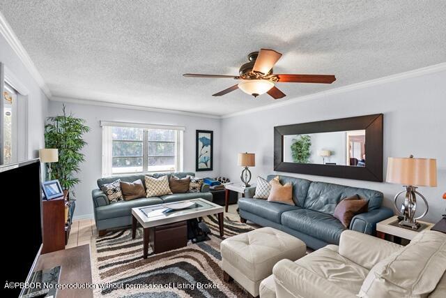 14 Bamboo Lane Jupiter, FL 33458 - Photo 18 of 33 a living room with furniture ceiling fan and a flat screen tv