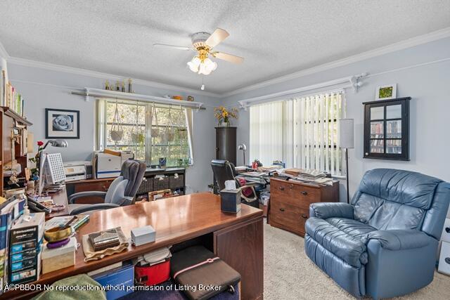 14 Bamboo Lane Jupiter, FL 33458 - Photo 21 of 33 a living room with furniture and a flat screen tv