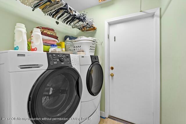 14 Bamboo Lane Jupiter, FL 33458 - Photo 23 of 33 a utility room with dryer and washer