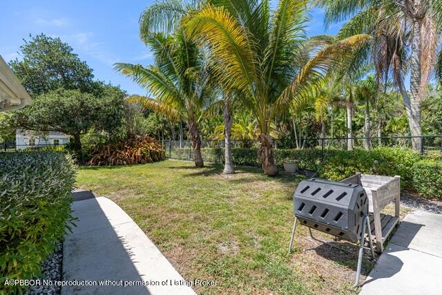 14 Bamboo Lane Jupiter, FL 33458 - Photo 27 of 33 a view of a backyard with sitting area