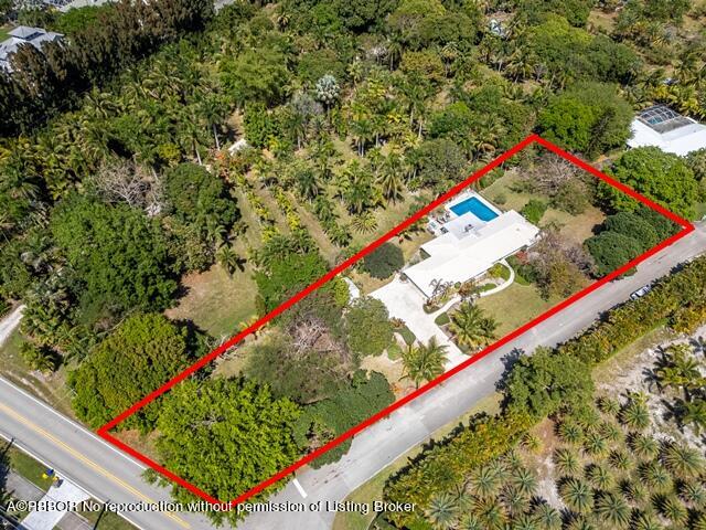 14 Bamboo Lane Jupiter, FL 33458 - Photo 3 of 33 a view of a backyard