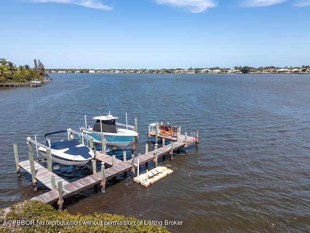 14 Bamboo Lane Jupiter, FL 33458 - Photo 31 of 33 a view of a terrace with a bench