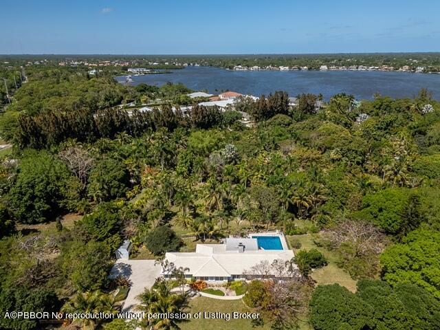 14 Bamboo Lane Jupiter, FL 33458 - Photo 4 of 33 an aerial view of a city with lots of residential buildings ocean and mountain view in back