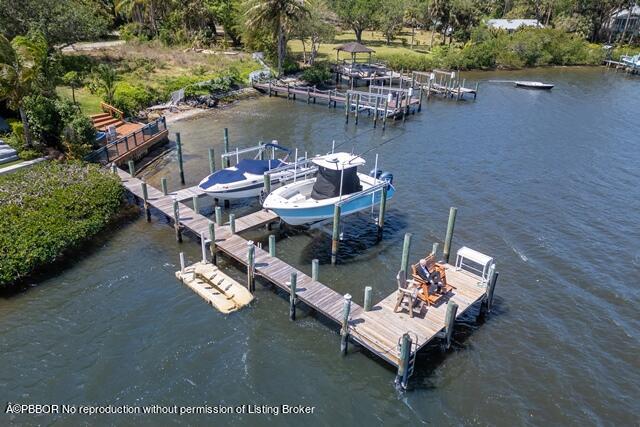 14 Bamboo Lane Jupiter, FL 33458 - Photo 5 of 33 an aerial view of a house with a lake view
