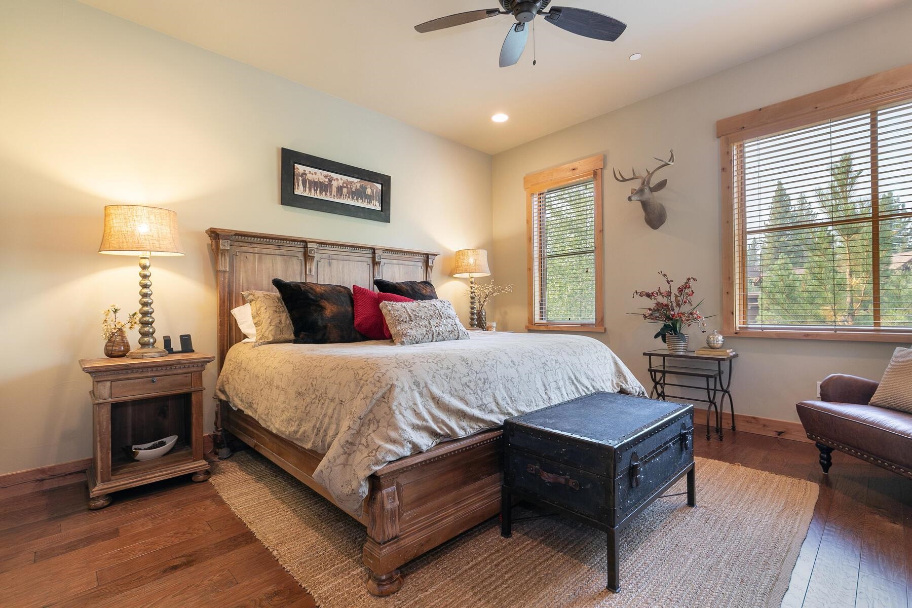 10100 Sagebrush Court, Unit 65 Truckee, CA 96161 - Photo 13 of 21 a bedroom with a bed wooden floor and a chandelier