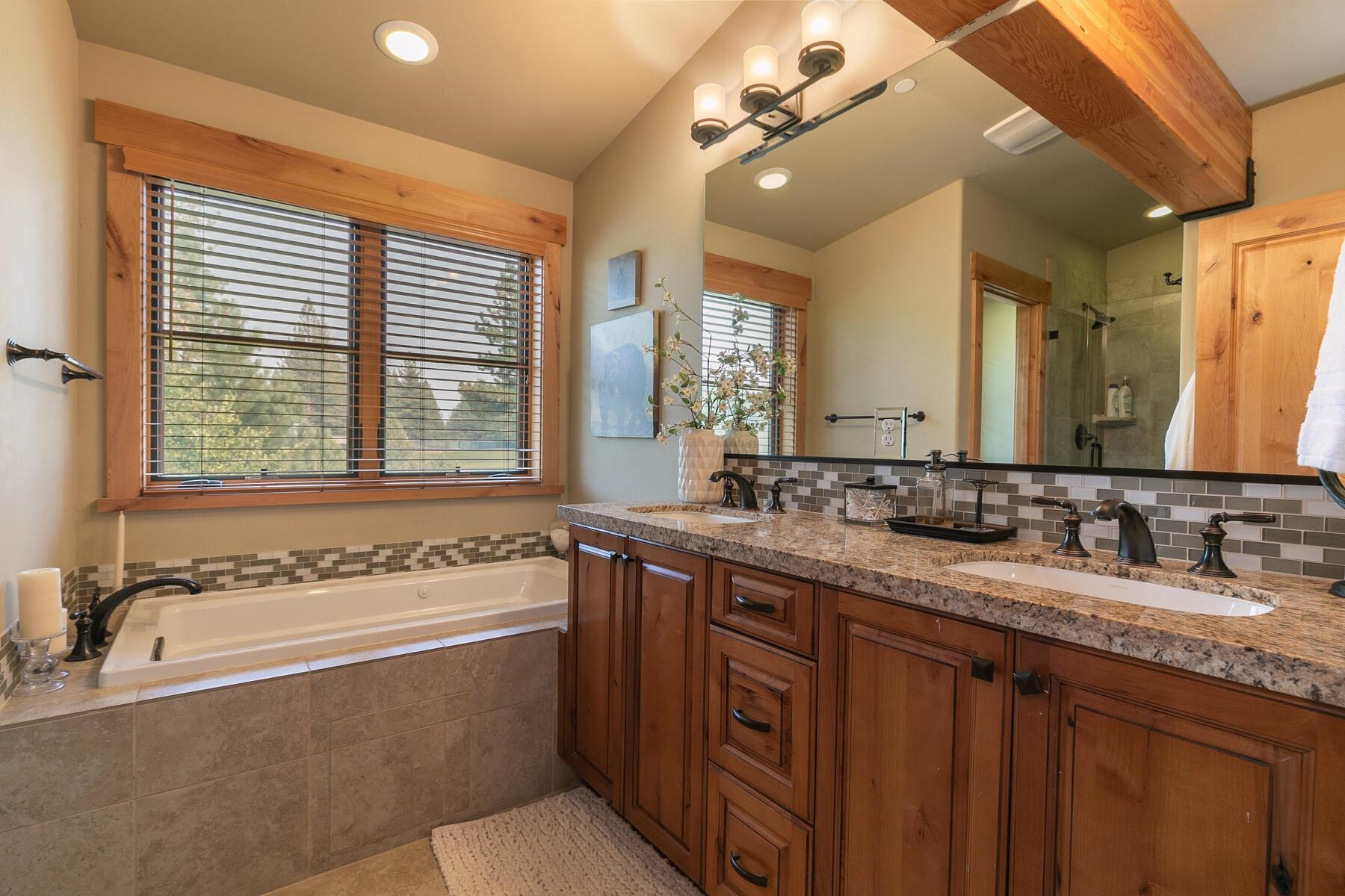 10100 Sagebrush Court, Unit 65 Truckee, CA 96161 - Photo 15 of 21 a bathroom with a granite countertop sink and a bathtub