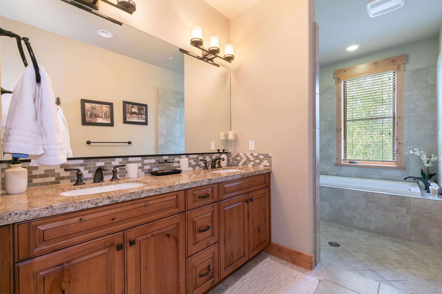 10100 Sagebrush Court, Unit 65 Truckee, CA 96161 - Photo 16 of 21 a bathroom with a double vanity sink and a mirror