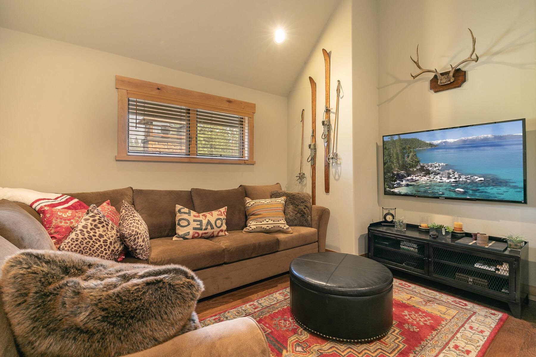 10100 Sagebrush Court, Unit 65 Truckee, CA 96161 - Photo 17 of 21 a living room with furniture and a flat screen tv