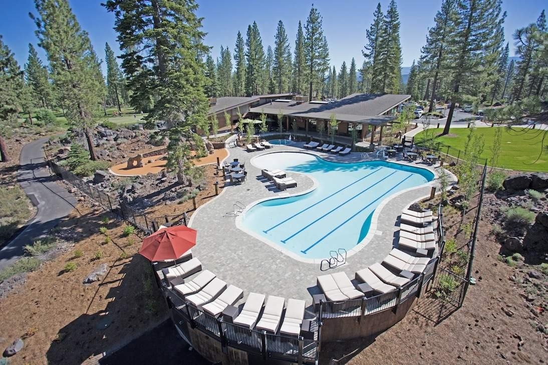10100 Sagebrush Court, Unit 65 Truckee, CA 96161 - Photo 19 of 21 a view of a patio with table and chairs with wooden floor and fence