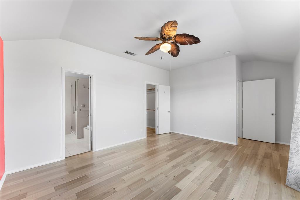 114 Rio Grande Drive Crandall, TX 75114 - Photo 16 of 34 an empty room with wooden floor and windows