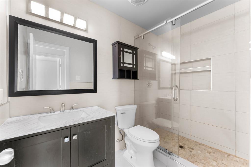 114 Rio Grande Drive Crandall, TX 75114 - Photo 23 of 34 a bathroom with a sink a toilet and shower