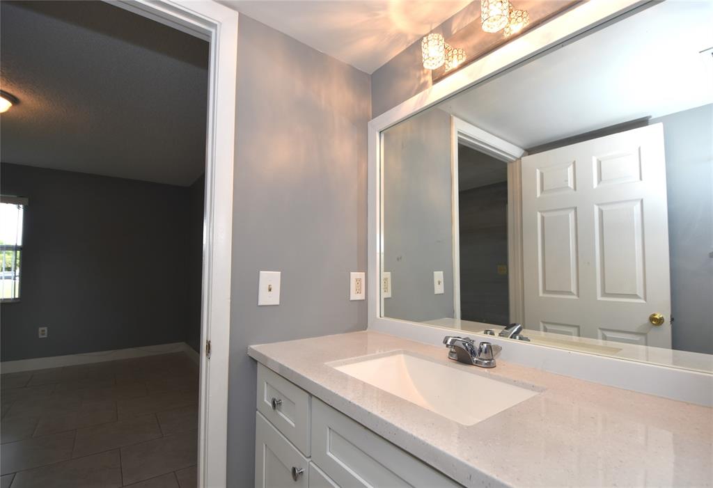 231 Southwest 113th Way, Unit 231 Pembroke Pines, FL 33025 - Photo 18 of 39 a bathroom with a sink and a mirror
