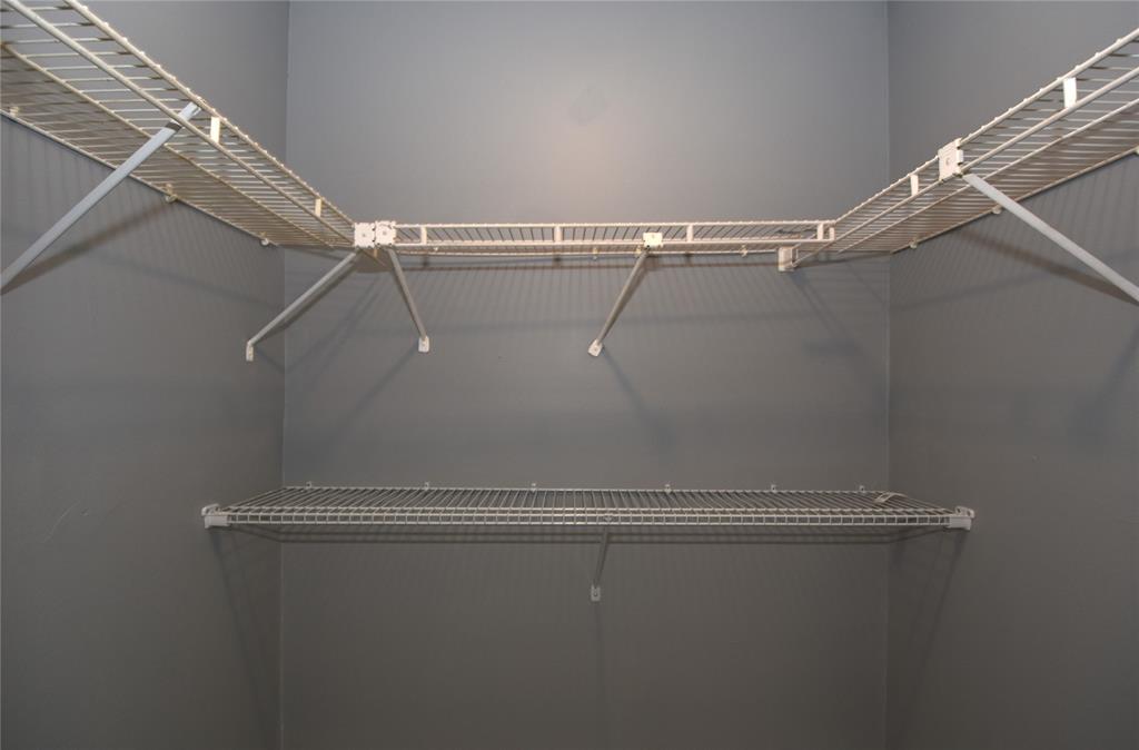 231 Southwest 113th Way, Unit 231 Pembroke Pines, FL 33025 - Photo 19 of 39 a view of a room with racks on the wall