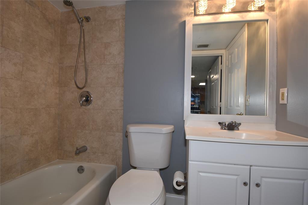 231 Southwest 113th Way, Unit 231 Pembroke Pines, FL 33025 - Photo 24 of 39 a bathroom with a toilet sink vanity tub and shower