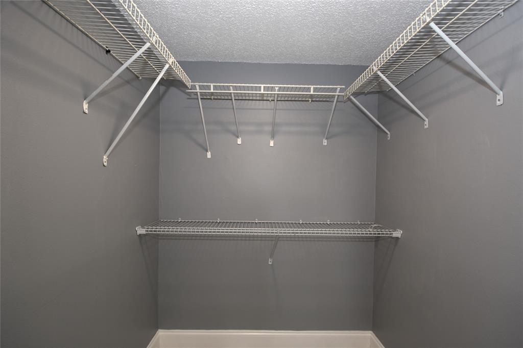 231 Southwest 113th Way, Unit 231 Pembroke Pines, FL 33025 - Photo 26 of 39 a view of a room with racks on the wall
