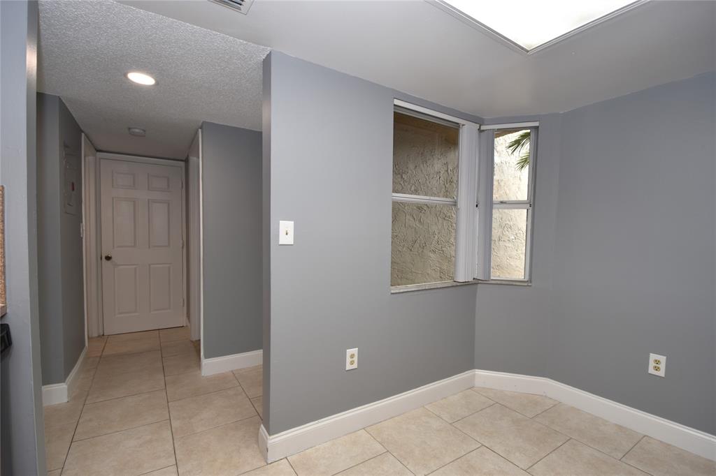 231 Southwest 113th Way, Unit 231 Pembroke Pines, FL 33025 - Photo 29 of 39 a view of an empty room with window and closet area
