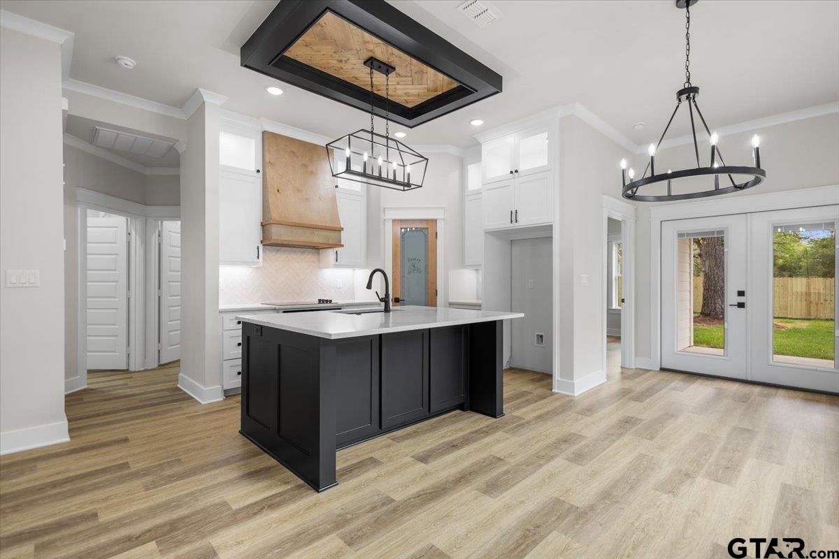 3022 West Rose Street Tyler, TX 75701 - Photo 14 of 46 a kitchen with stainless steel appliances granite countertop a sink a stove a refrigerator and a wooden floor