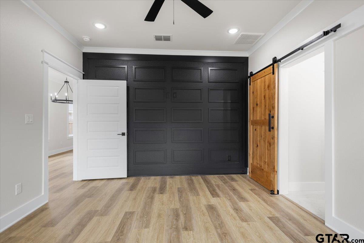 3022 West Rose Street Tyler, TX 75701 - Photo 22 of 46 wooden floor in an empty room