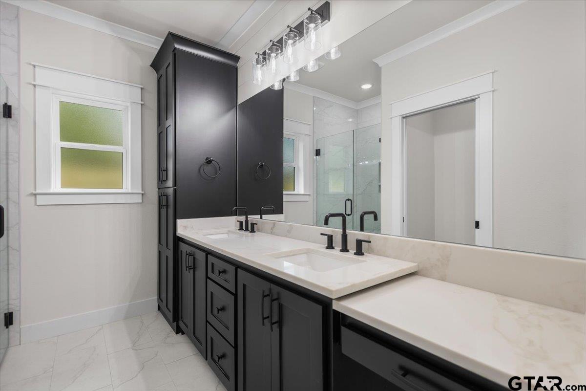 3022 West Rose Street Tyler, TX 75701 - Photo 25 of 46 a spacious bathroom with a double vanity sink and a mirror