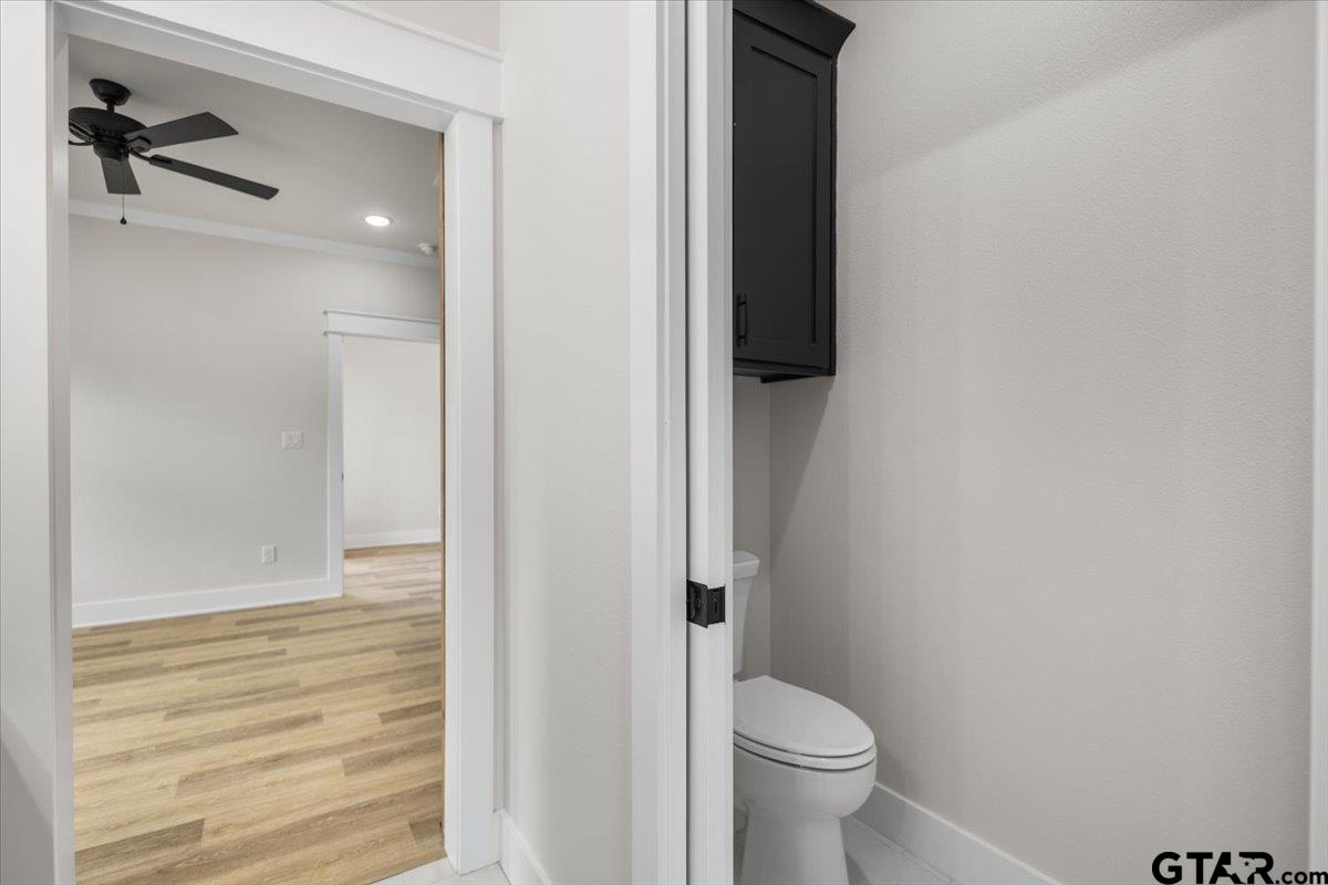 3022 West Rose Street Tyler, TX 75701 - Photo 26 of 46 a bathroom with a toilet and a shower