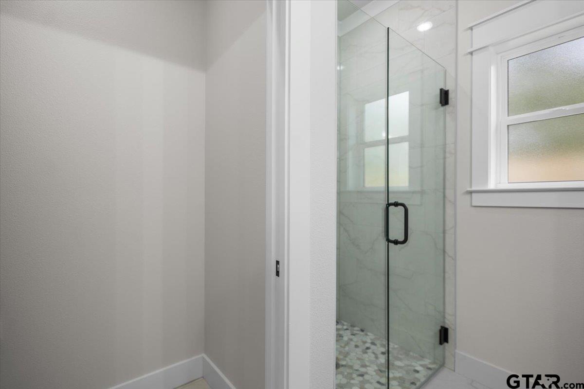3022 West Rose Street Tyler, TX 75701 - Photo 27 of 46 a bathroom with a shower