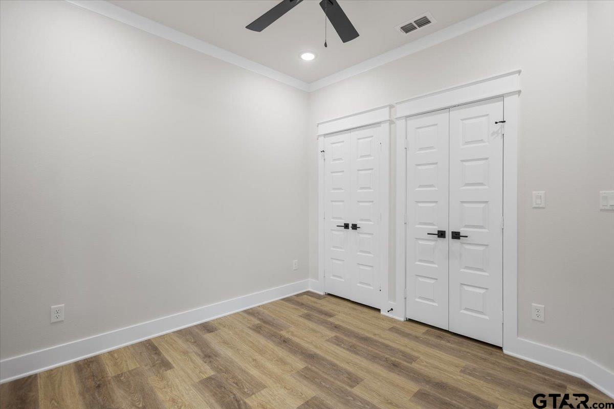 3022 West Rose Street Tyler, TX 75701 - Photo 37 of 46 wooden floor in an empty room