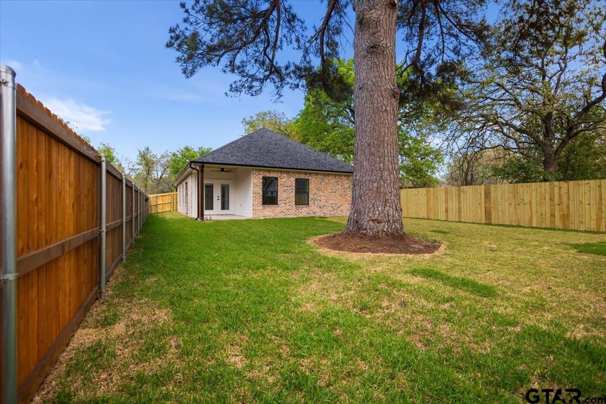 3022 West Rose Street Tyler, TX 75701 - Photo 40 of 46 a view of a house with backyard and tree