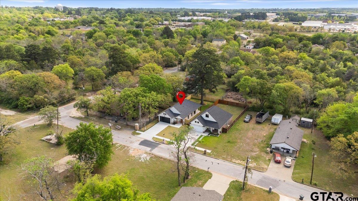 3022 West Rose Street Tyler, TX 75701 - Photo 42 of 46 an aerial view of residential houses with outdoor space