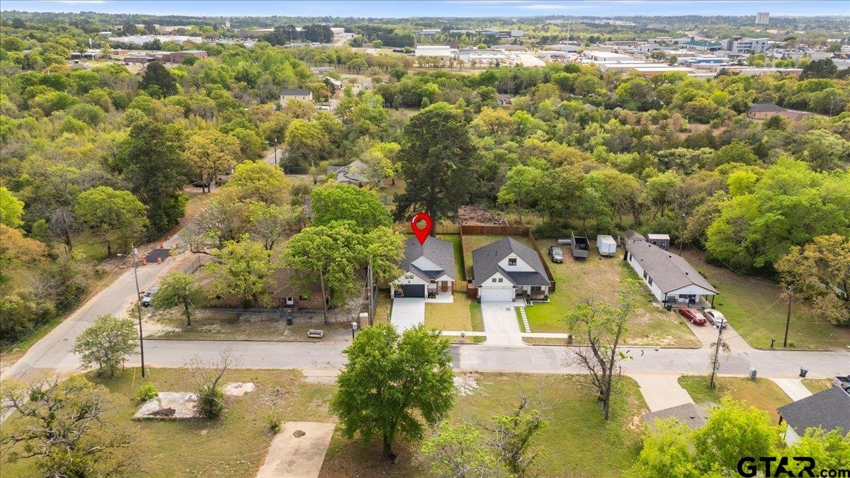 3022 West Rose Street Tyler, TX 75701 - Photo 43 of 46 an aerial view of residential houses with outdoor space