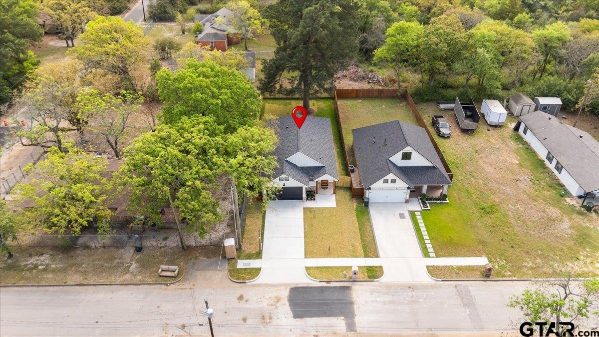 3022 West Rose Street Tyler, TX 75701 - Photo 44 of 46 an aerial view of residential houses with outdoor space