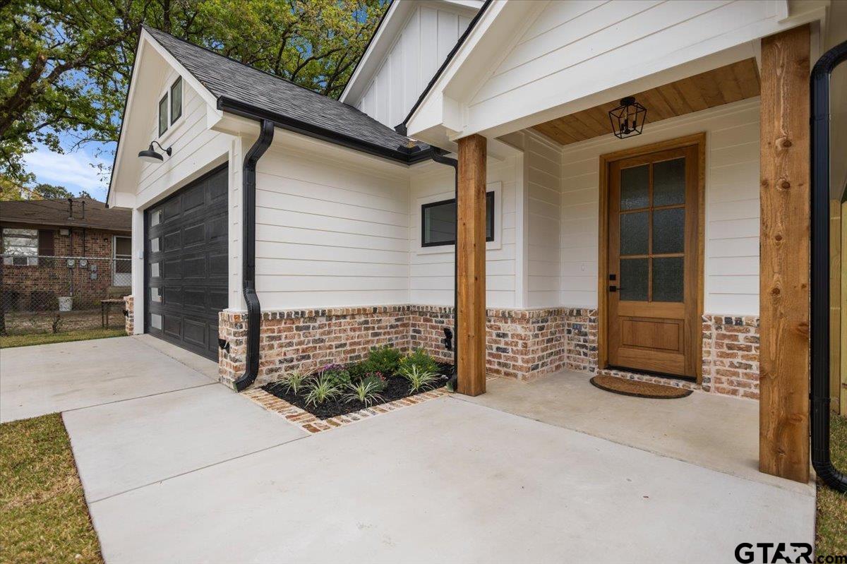 3022 West Rose Street Tyler, TX 75701 - Photo 5 of 46 a front view of a house with a garage